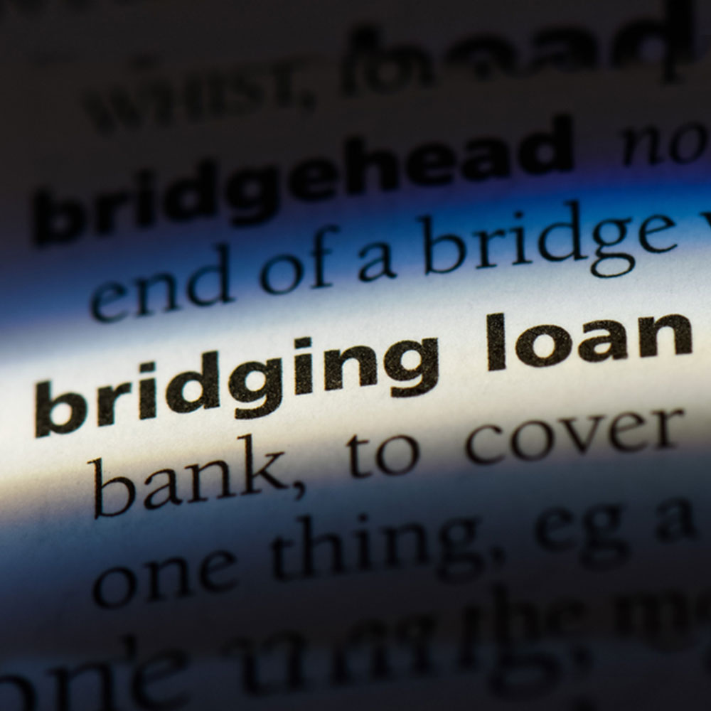 Bridging loan word in a dictionary representing the search for bridging loan facts.