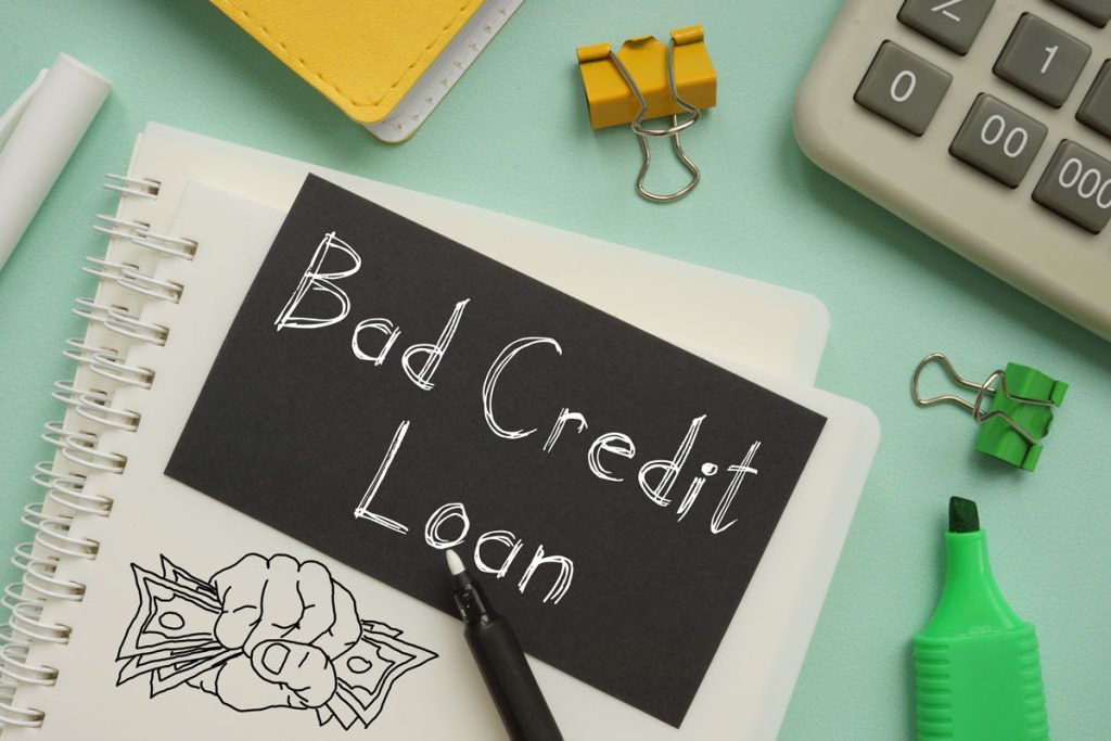 A notebook page with ideas on obtaining a loan in Singapore for bad credit.