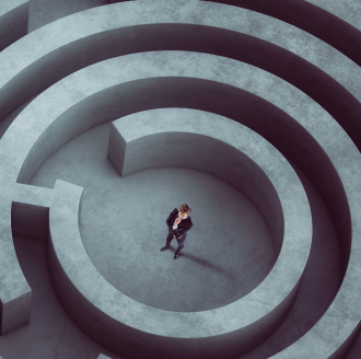 man standing center of maze