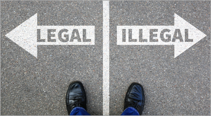 A man at a forked road with the words legal and illegal, which depicts a comparison between legal and illegal money lenders
